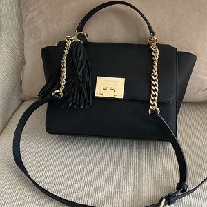 Black leather Michael Kors crossbody convertible to a satchel.